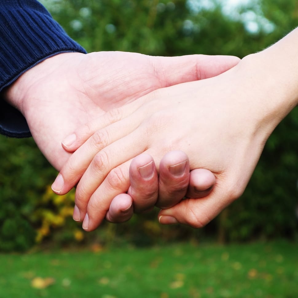 a couple holding hands