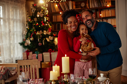 a family smiling and enjoying a safe happy holidays