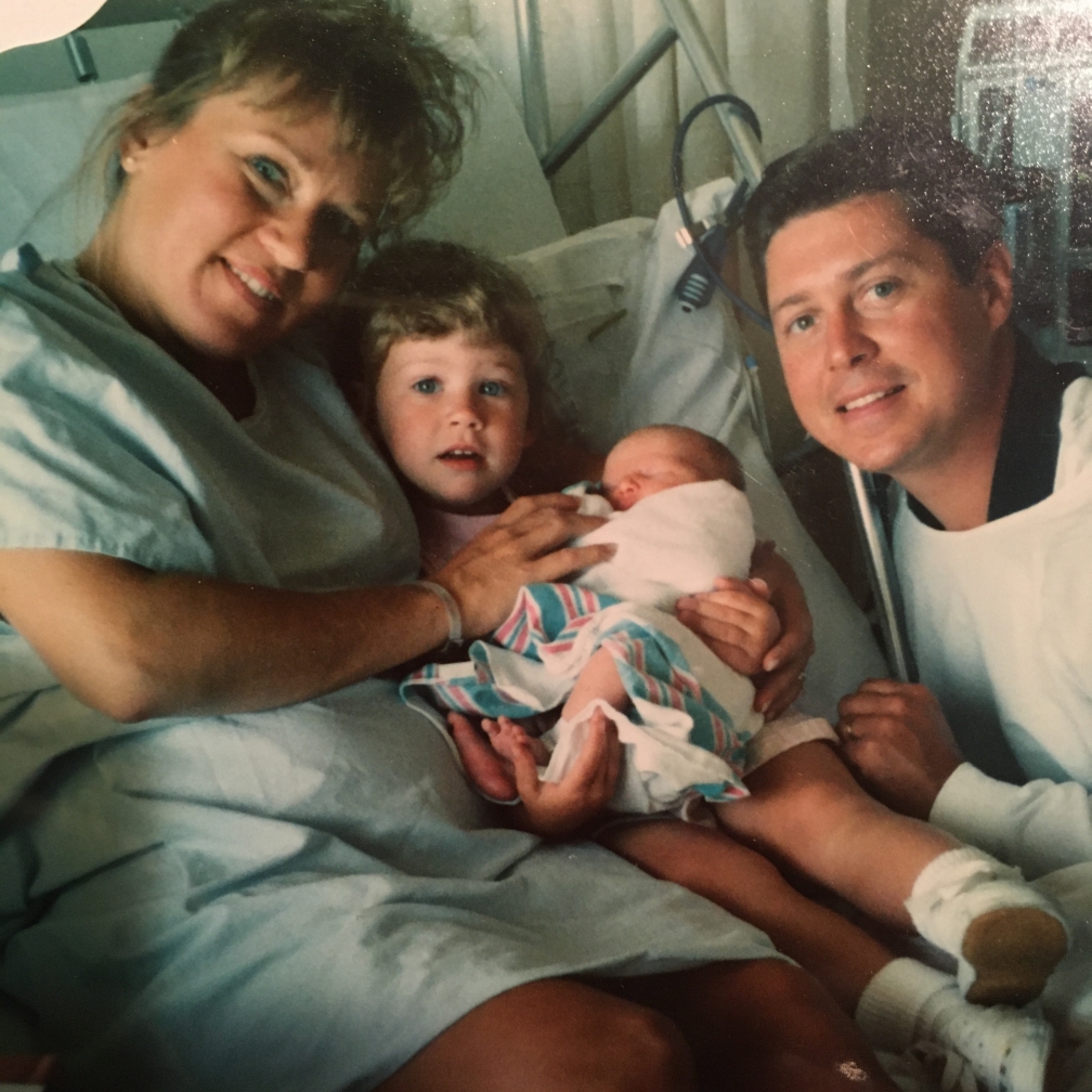 The Nesselbush family with young Ashley holding a newborn Dakota